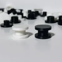 3D printed DIY charm backers for Bogg Bags in white and black, flatlay