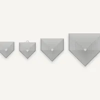 Four nested home plate fidget toys in varying sizes, all in a light gray color, with the second smallest having a small loop at the top.