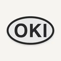 Oval Ocracoke Island OKI Bogg Bag charm, black lettering on light gray
