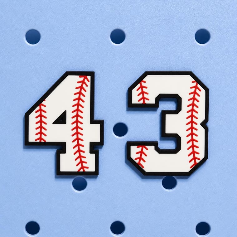 Personalized baseball jersey number Bogg Bag charm in navy blue, number 12, flatlay