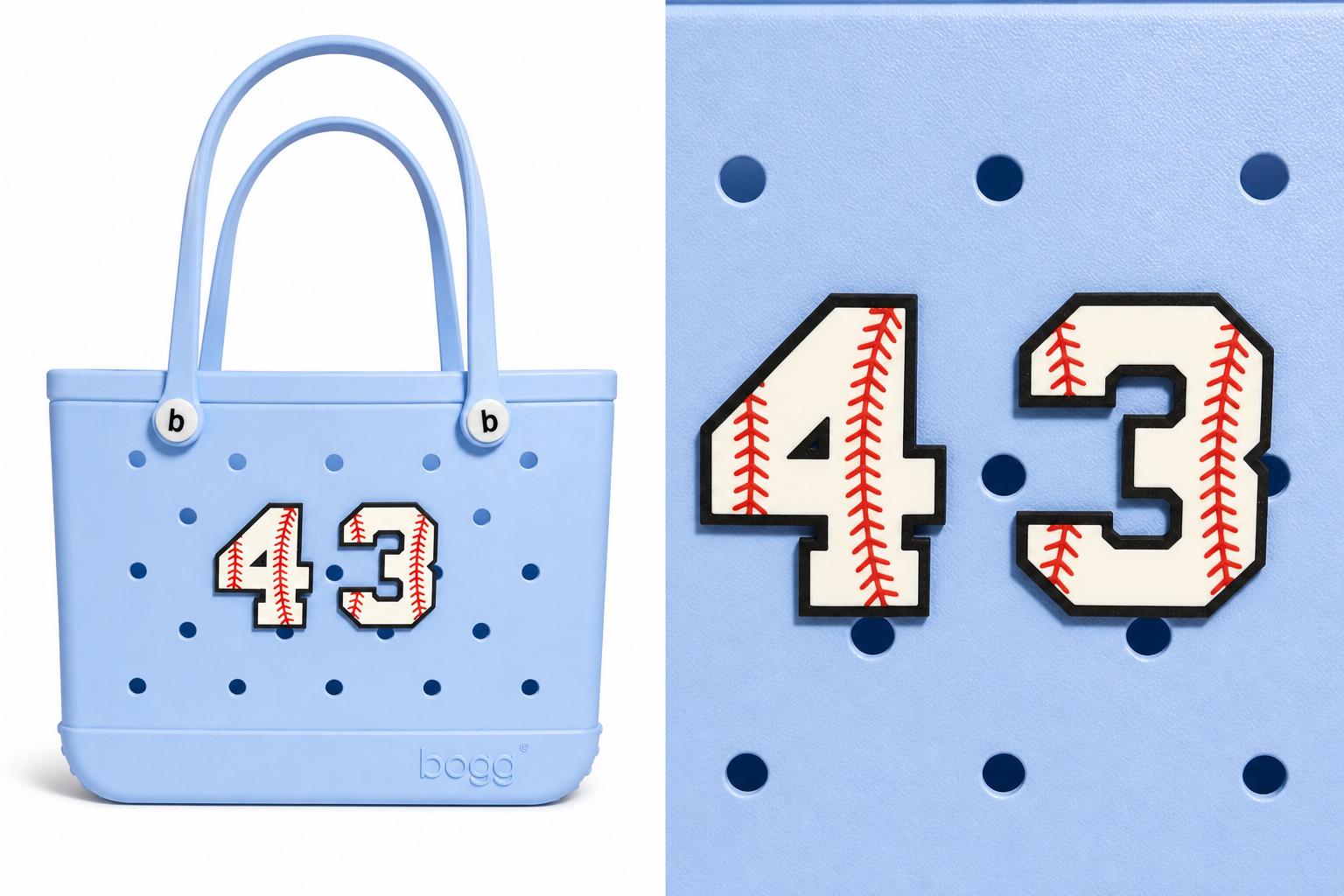Number charm shown clipped to a ballpark tote bag, lifestyle photo
