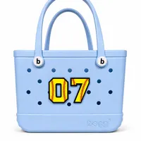 Personalized softball jersey number charm for Bogg Bags in pink, number 7, flatlay