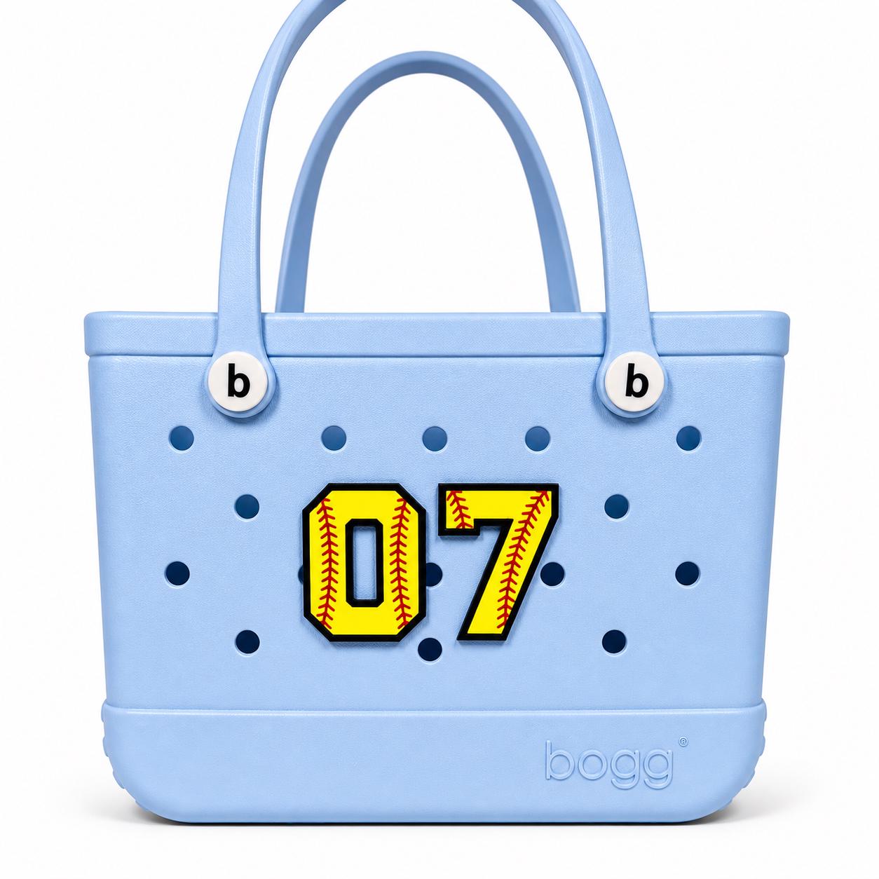 Personalized softball jersey number Bogg Bag charm in pink, number 7, flatlay